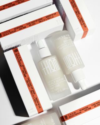 Boxes of THOM Scalp Serum haircare