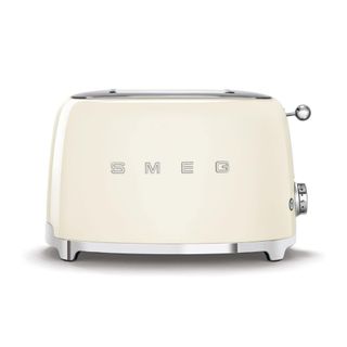 A cream white Smeg toaster with silver feet and silver handles