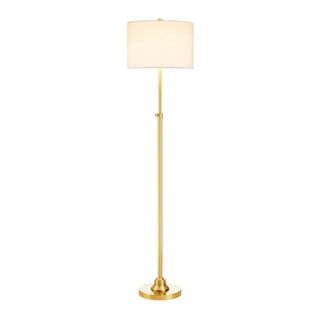 A floor lamp with a gold base and white lampshade