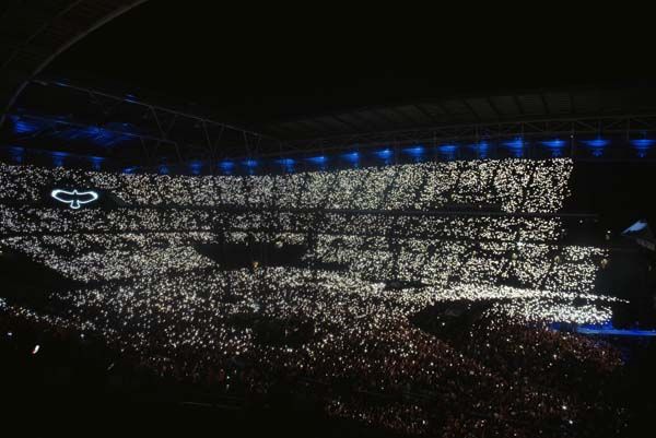 The Wembley crowd at might, lit up with smartphone torches
