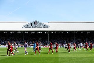 A general view of the inside of the stadium as players of Fulham and Liverpool take the field prior to kick off of the Premier League match between Fulham FC and Liverpool FC at Craven Cottage on August 06, 2022 in London, England.