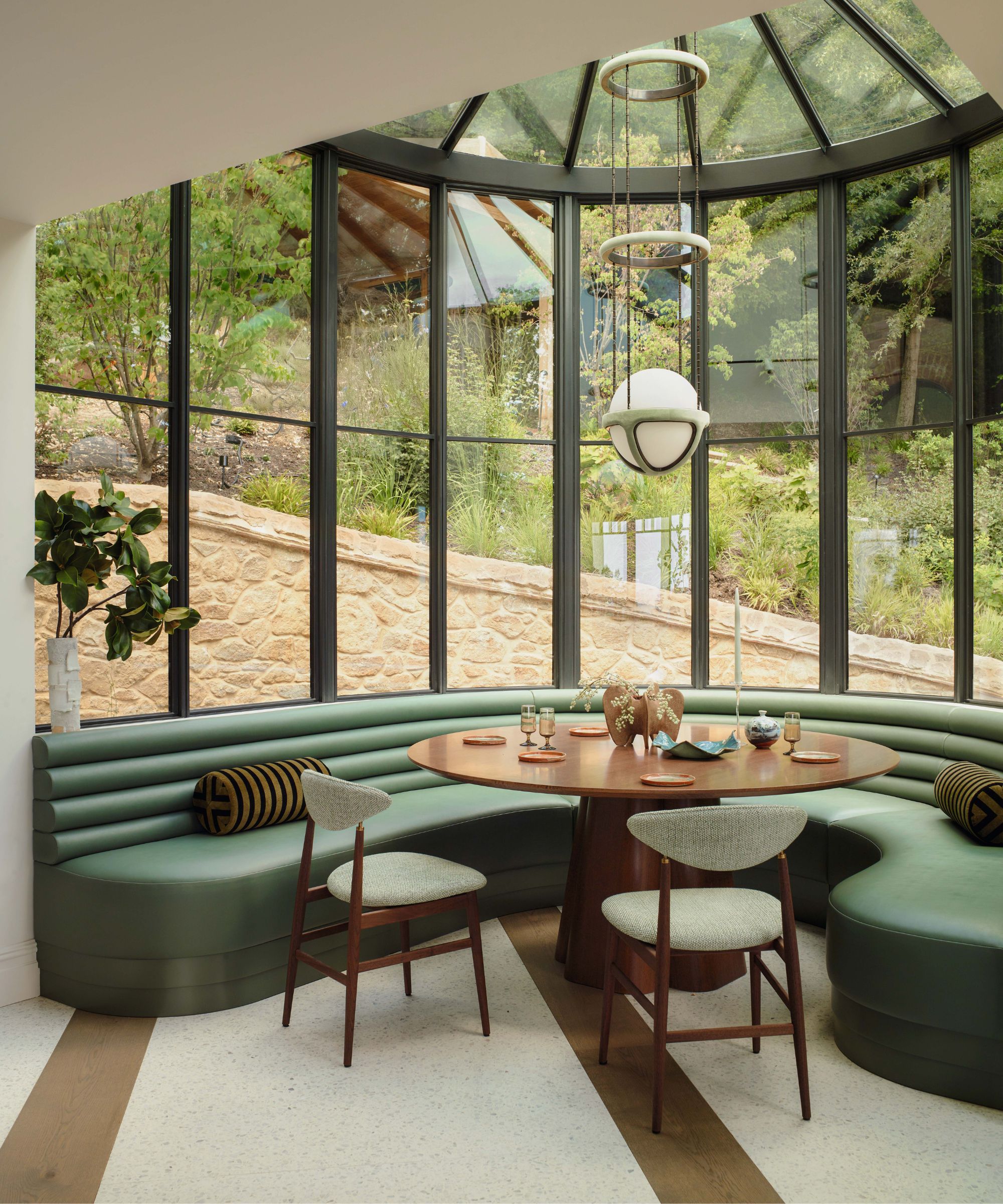 a conversatory style breakfast noook with curved banquette