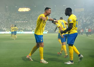 Cristiano Ronaldo of Al-Nassr Club celebrates with :Sadio Mane of Al Nassr Club after scoring his teams first goal during the Saudi Pro League match between Al- Nassr and Al-Ahli at King Saud University Stadium on September 22, 2023 in Riyadh, Saudi Arabia. (Photo by Francois Nel/Getty Images)