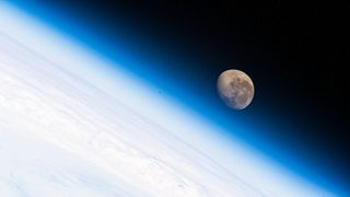 The waning gibbous Moon is pictured above the Earth's horizon as the International Space Station orbited 272 miles above the Atlantic Ocean off the coast of southern Argentina in this image taken on Jan. 21, 2022.