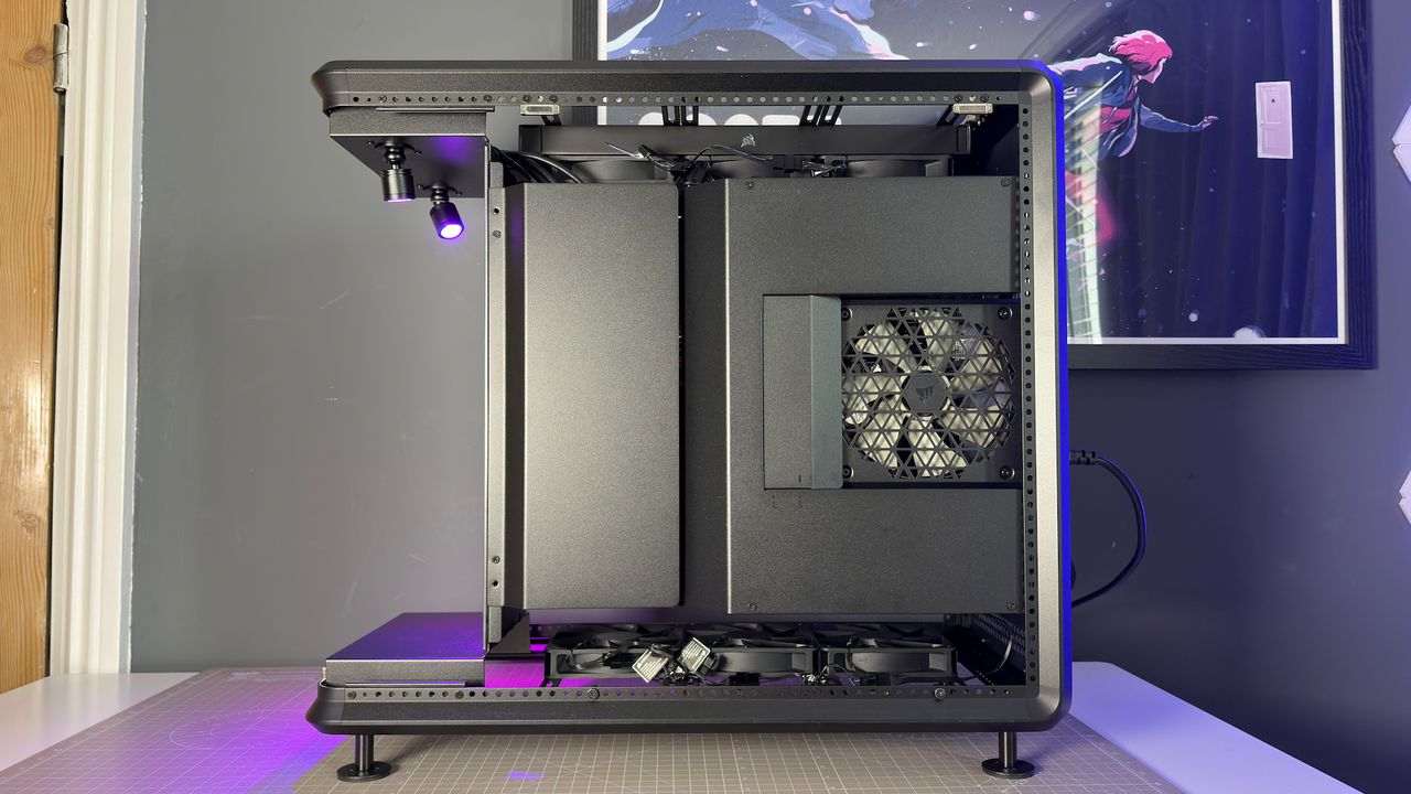 The CoolerMaster MasterFrame 360 Panoramic PC case with various components installed on a desk.