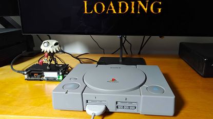 Original PlayStation console on unit next to OSSC upscaler with Sir Dan MediEvil figure on top.