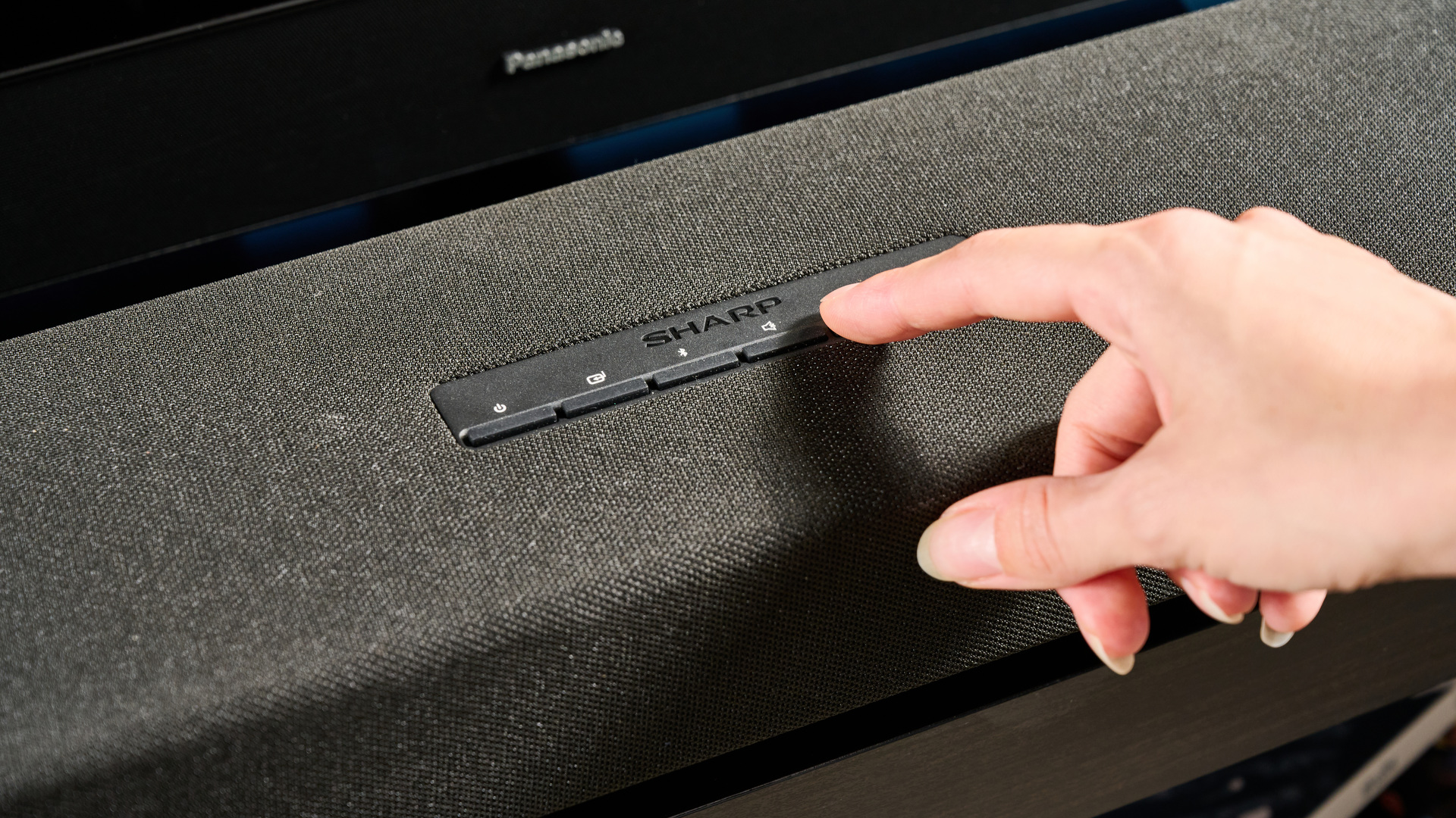 The Sharp 5.1.2 HT-SBW55121 Soundbar photographed in front of a blue background.