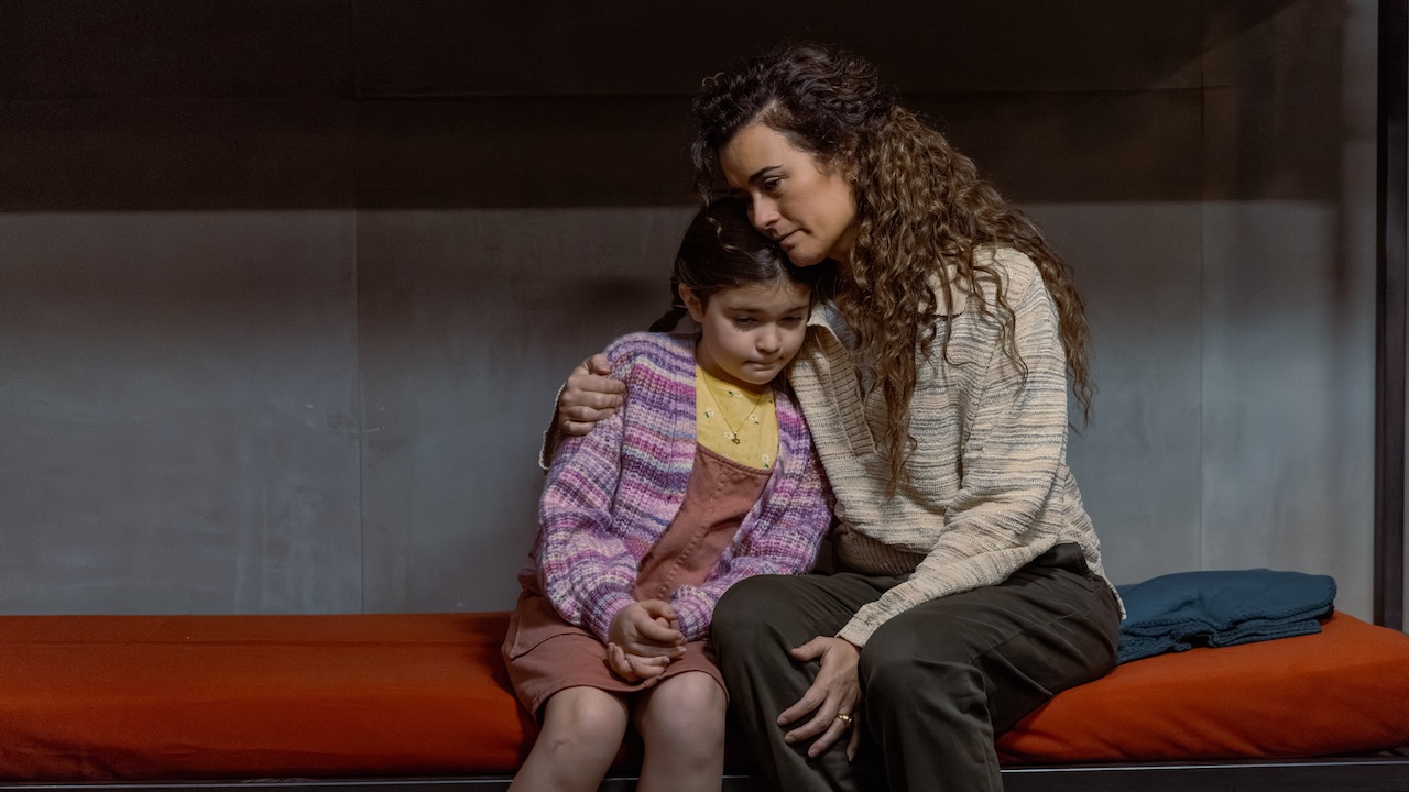 Ziva holding younger Tali on lower bunk bed in their cabin&#039;s panic room