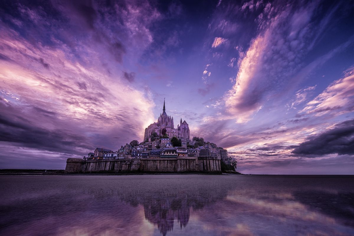 Mont Saint Michele captured with a vivid purple sky