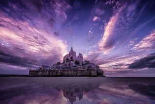 Mont Saint Michele captured with a vivid purple sky