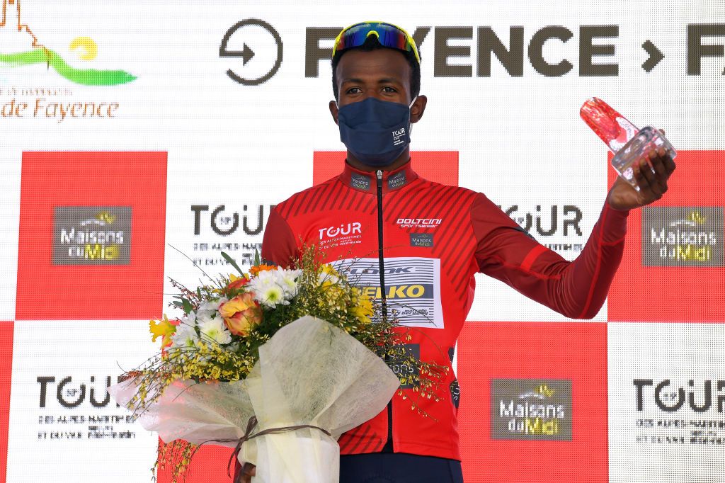 FAYENCE FRANCE FEBRUARY 20 Podium Hailu Biniam Girmay of Eritrea and Team Delko Red Mountain Jersey celebrate during the 53rd Tour Des Alpes Maritimes Et Du Var Stage 2 a 1689km stage from Fayence to Fayence 357m Mask Covid safety measures Flowers Trophy letour0683 on February 20 2021 in Fayence France Photo by Luc ClaessenGetty Images