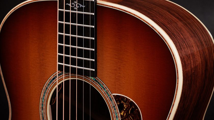 A cropped photo showing Taylor&#039;s 814e SB Super Auditorium acoustic guitar