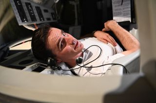 Mercury astronaut Gordon Cooper, portrayed by Colin O'Donoghue, during a training session in a Mercury capsule simulator in the fourth episode of the National Geographic series "The Right Stuff" streaming on Disney Plus.