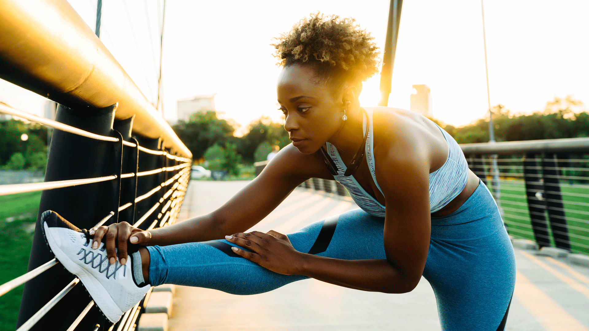 7 anxiety tips: Woman stretching on a bridge