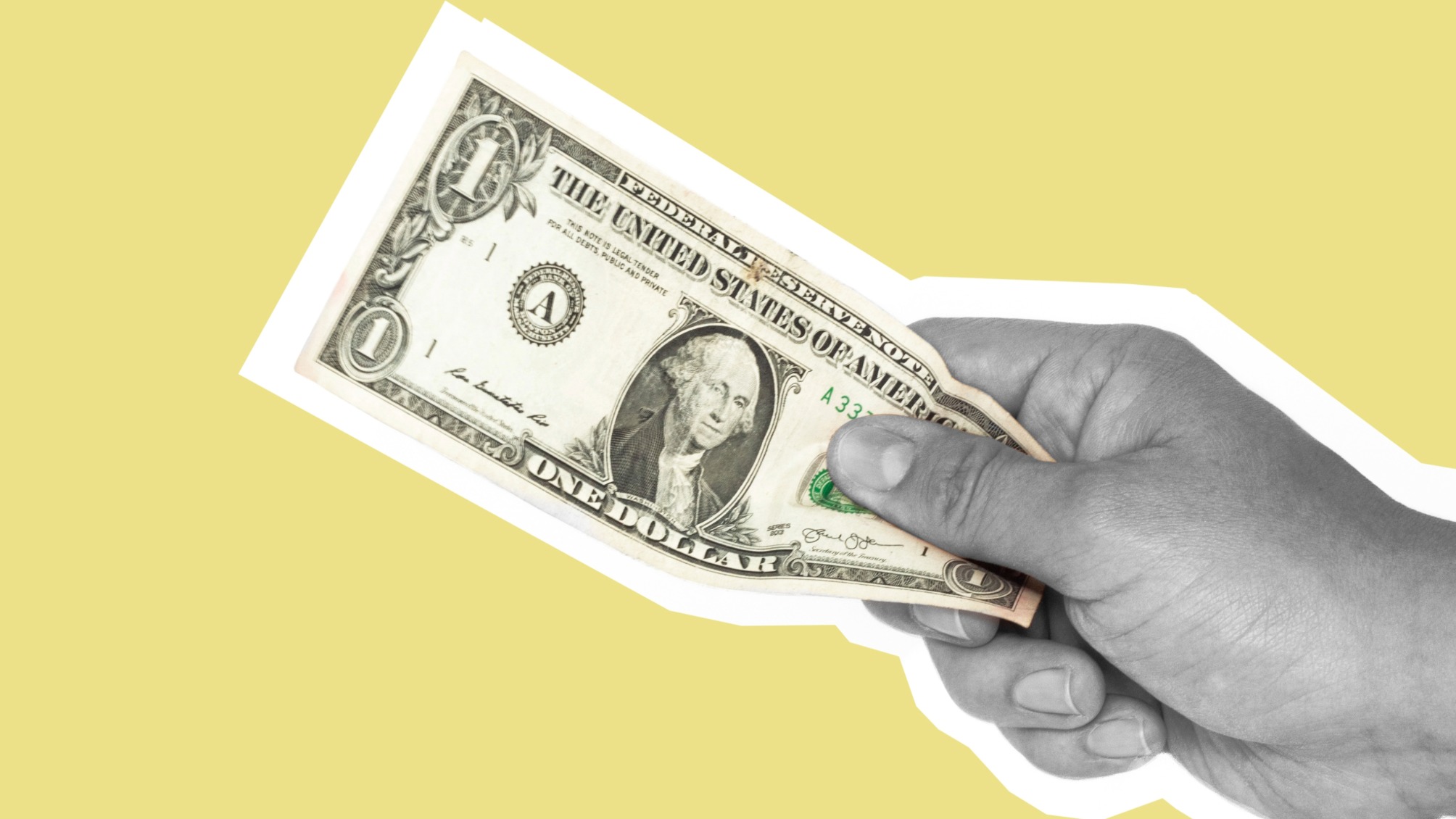 Hand holding a U.S. one-dollar bill against a yellow background