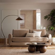 Next lamp and neutral sofa with orb coffee table