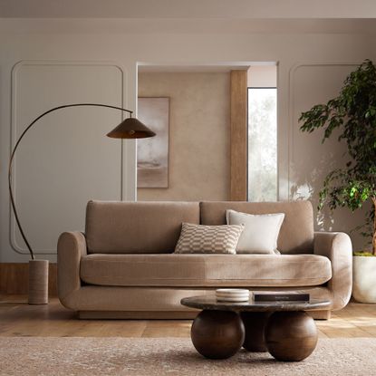 Next lamp and neutral sofa with orb coffee table