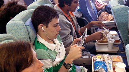 People on a plane © Alamy