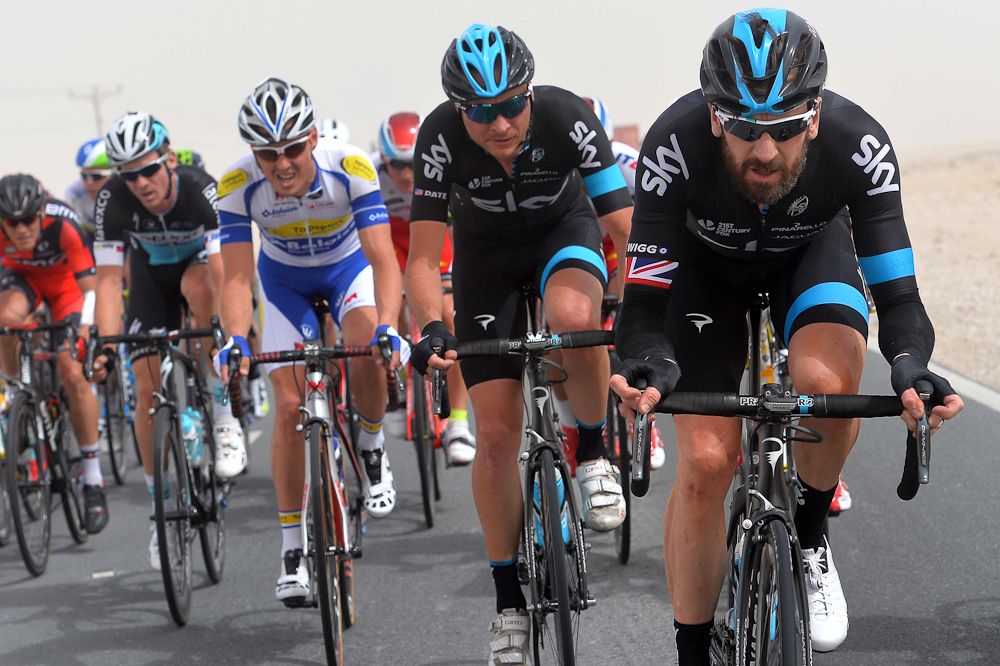 Bradely Wiggins drives the pace in the desert.