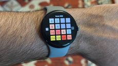 The Pixel Watch 3 displaying a Wear OS game, specifically a port of 2048.