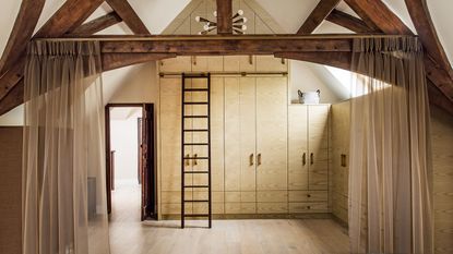 natural wood loset with ladder and wooden beams