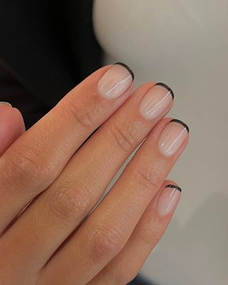 A black and milky white french manicure by Georgia Rae