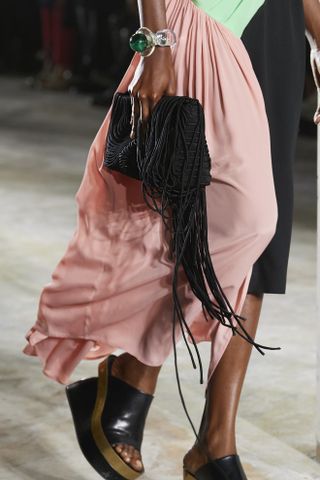 close up shot of black fringe clutch on Dries Van Noten runway