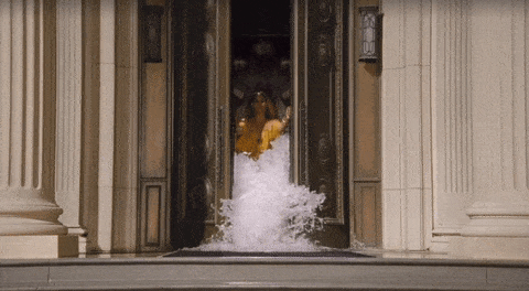 Beyonce opening a door to release a flood