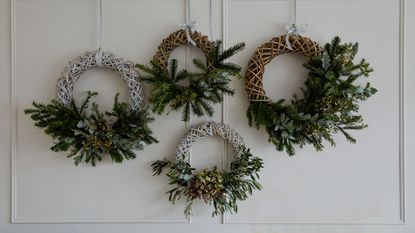 Large green wreath with lights woven around