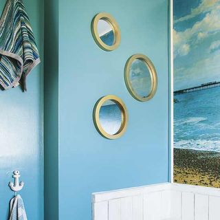bathroom with mirror and deep sea blue