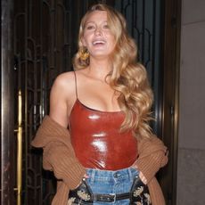 Blake Lively wearing Tory Burch bodysuit and Stella McCartney's leather denim chaps in New York City August 2024