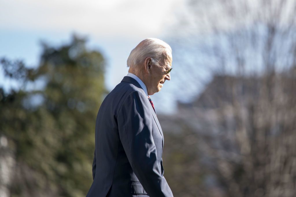 Biden walks on the South Lawn of the White House before boarding Marine One