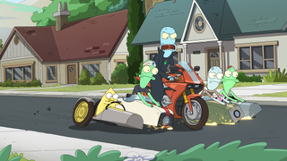 five aliens riding motorcycles down a suburban street