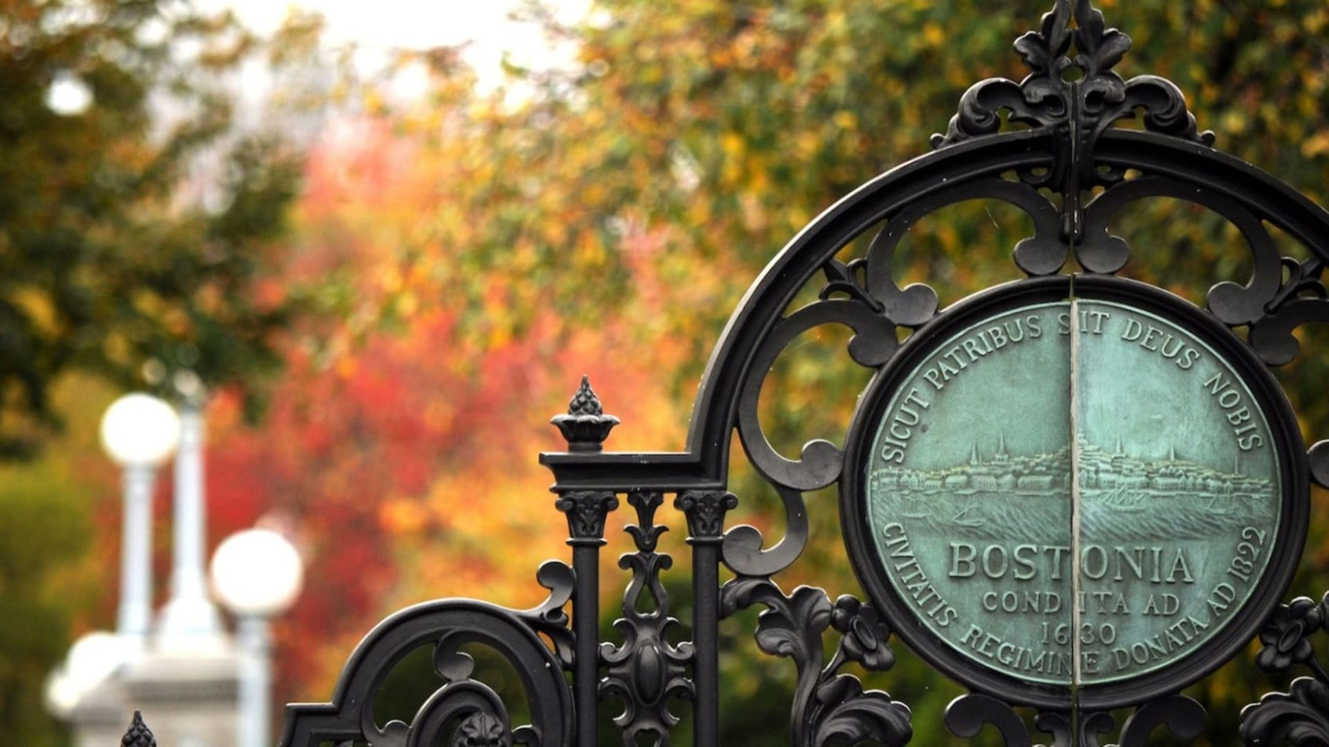 A photo of the Medallion of Boston with autumnal trees