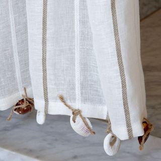 white bathroom curtains with shells attached