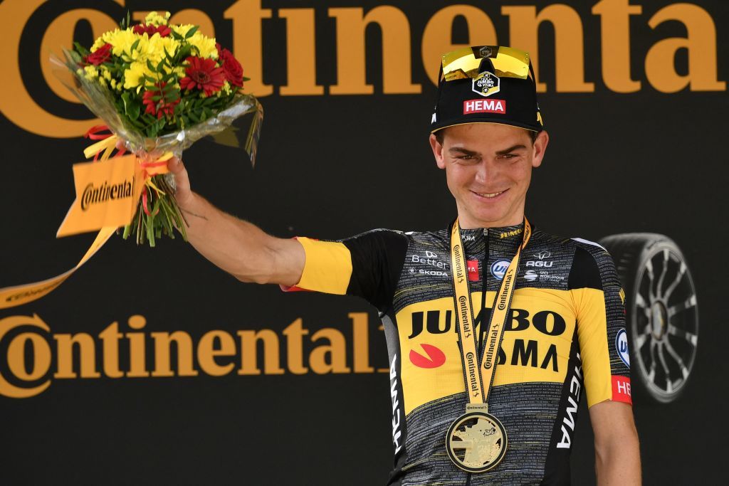 Team Jumbo Vismas Sepp Kuss of US celebrates on the podium at the end of the 15th stage of the 108th edition of the Tour de France cycling race 191 km between Ceret and AndorreLaVieille on July 11 2021 Photo by Philippe LOPEZ AFP Photo by PHILIPPE LOPEZAFP via Getty Images