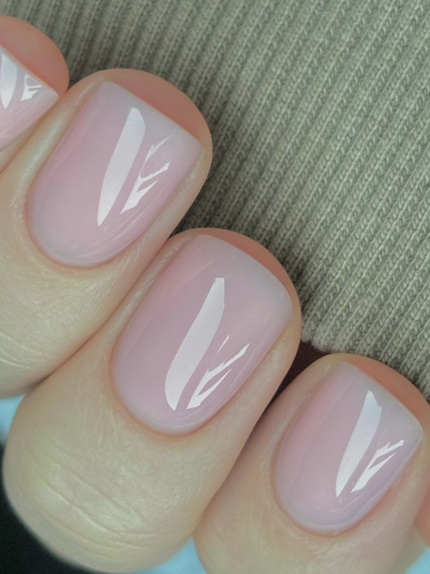 A close up of sheer pink nails by Harriet Westmoreland