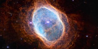 Bright lilac star at the center, surrounded by rusty orange clouds of dust in a large ring shape. 