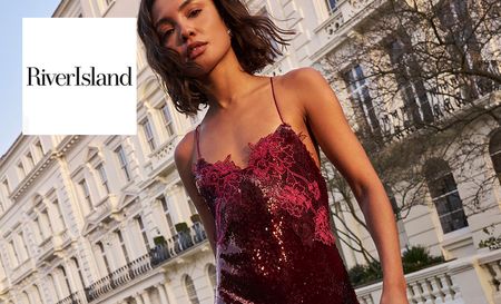 Model wearing a burgundy river island slip dress