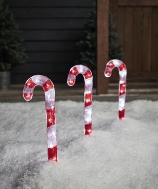 candy cane lights in the snow
