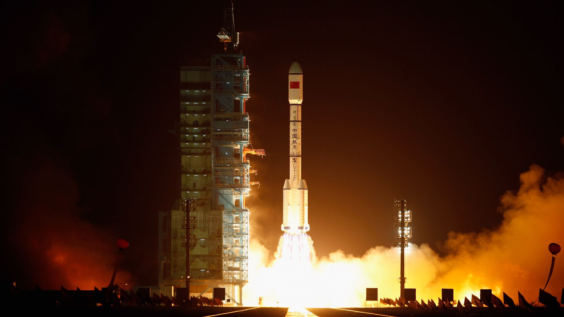 A Long March 2F rocket launching at night