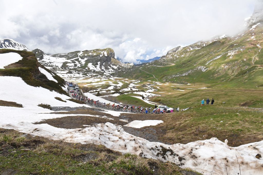 The pack rides during the seventh stage of the 73rd edition of the Criterium du Dauphine cycling race a 171km between SaintMartinLeVinoux and La Plagne on June 5 2021 Photo by Alain JOCARD AFP Photo by ALAIN JOCARDAFP via Getty Images