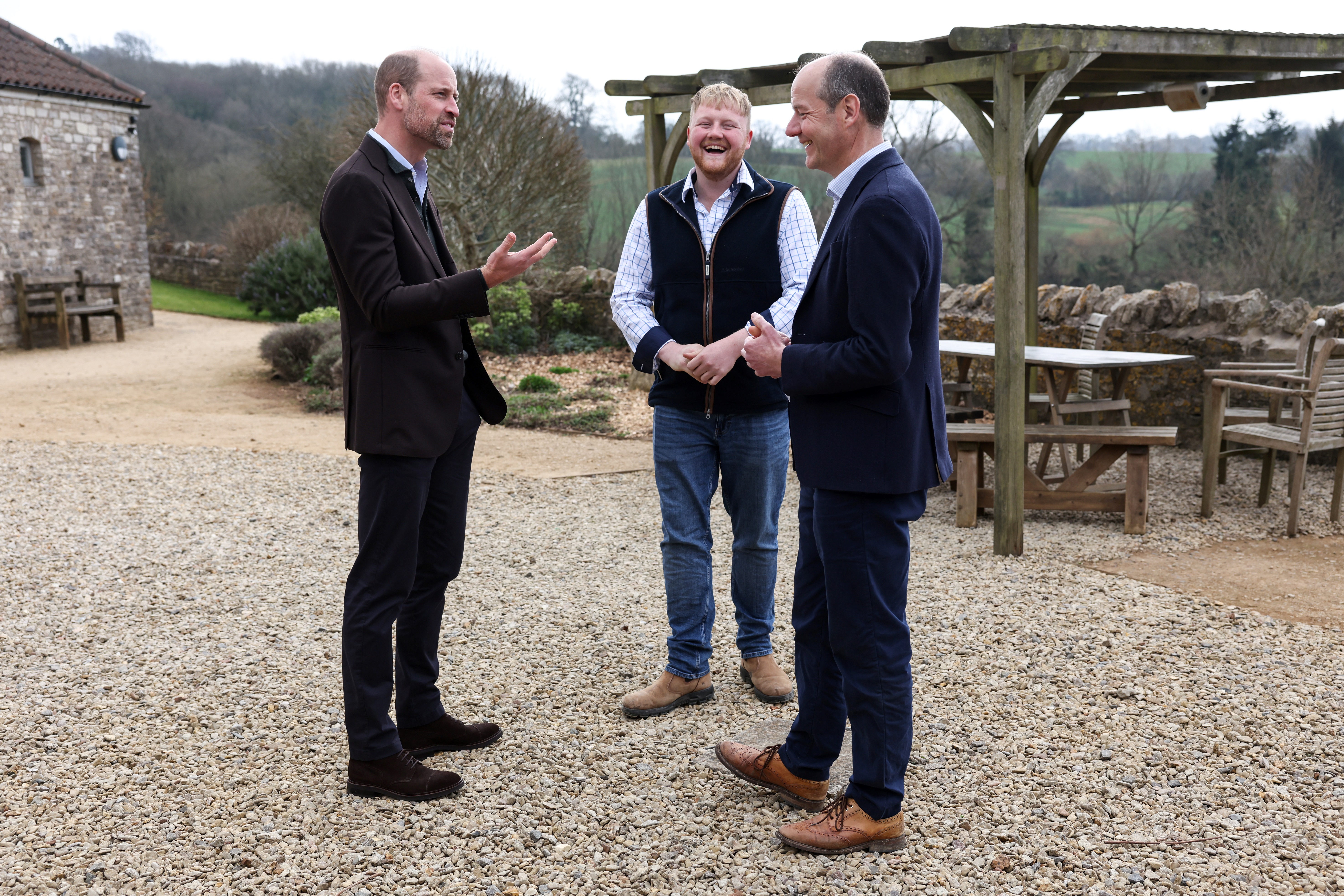 Prince William speaks with Clarkson's Farm stars Kaleb Cooper and Charlie Ireland during an event for sixty of the Duchy of Cornwall's next generation of farming tenants.