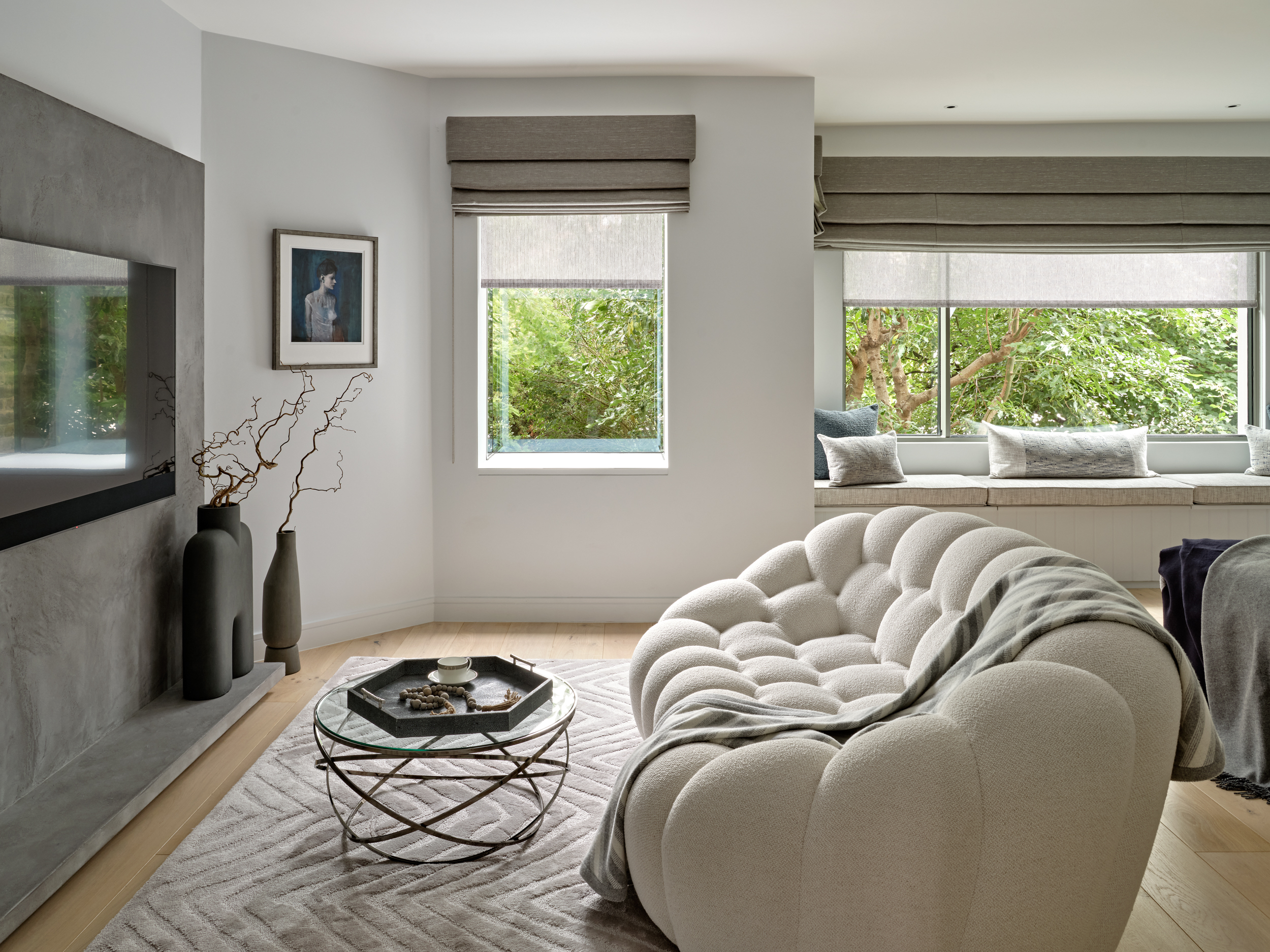 A three-dimensional sculptural sofa in white fabric in a contemporary living room
