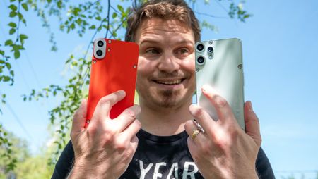 Comparing the backs and camera lenses of the orange CMF Phone 1 to the teal CMF Phone 2 Pro
