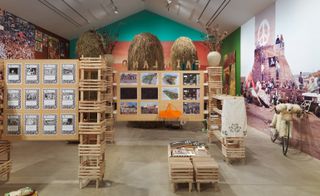 Gallery showing designs and wooden crates stacked