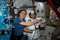 NASA astronaut Christina Koch (left) poses for a portrait with fellow Expedition 61 Flight Engineer Jessica Meir of NASA who is inside a U.S. spacesuit for a fit check for a spacewalk on Oct. 18, 2019. It will be the first all-female spacewalk in history.
