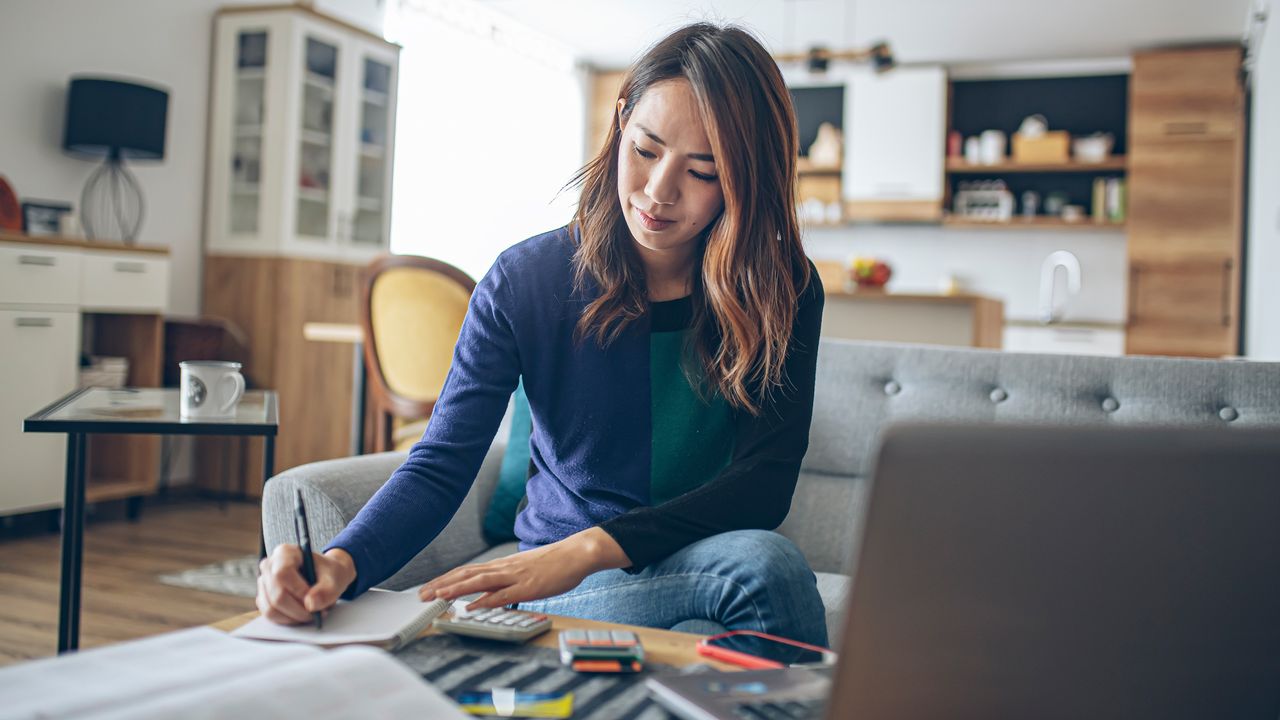 College student with laptop and calculator