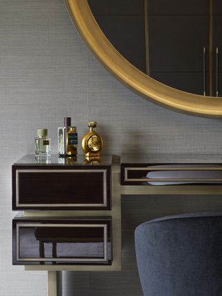 Textured wallpaper, mirror and side table