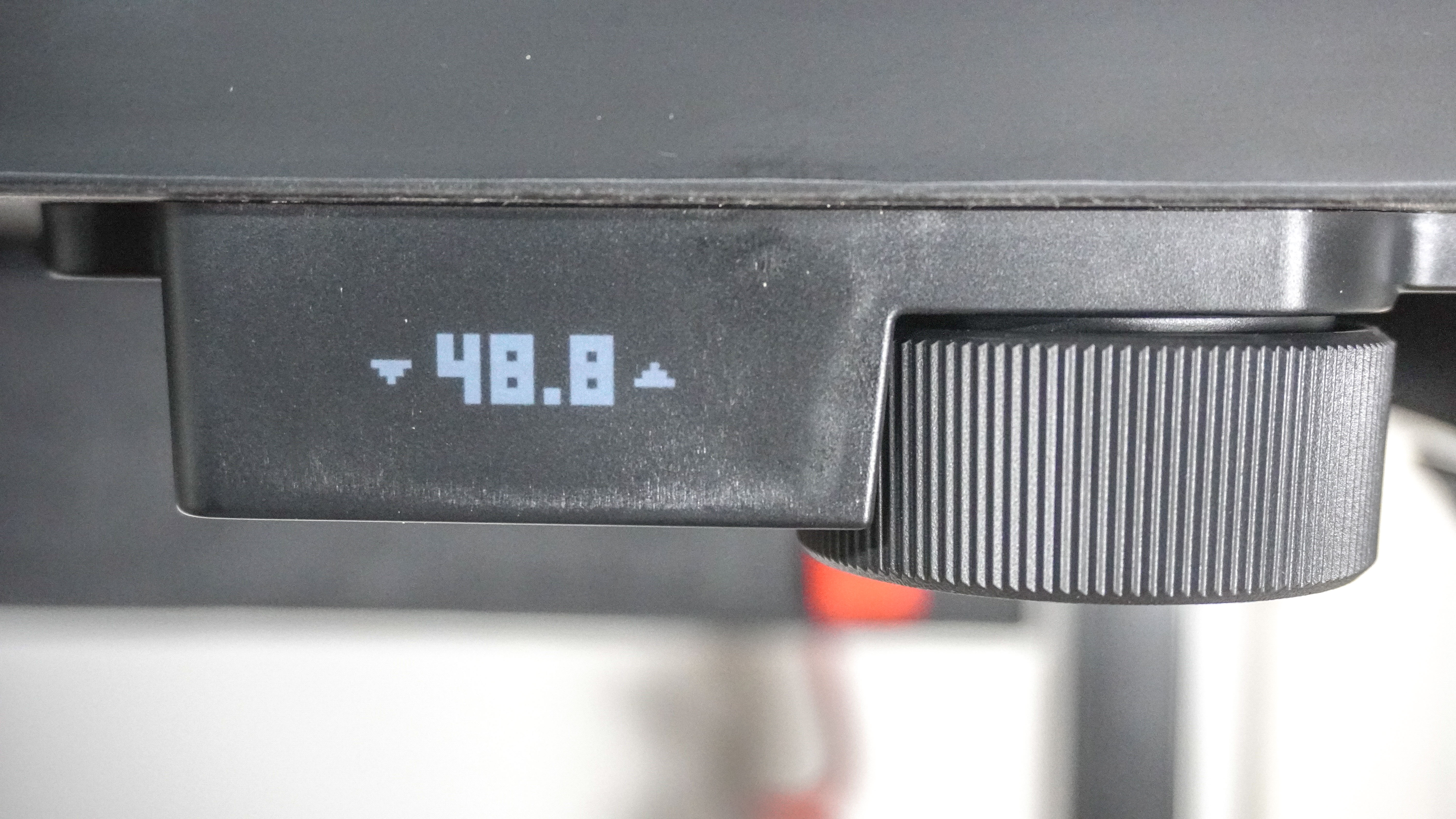 A close-up shot of the rotary dial used to control the Herman Miller Coyl Gaming Desk